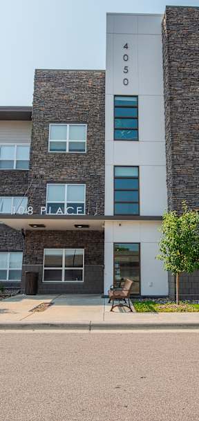 A large apartment building with the number 4050 on the side.