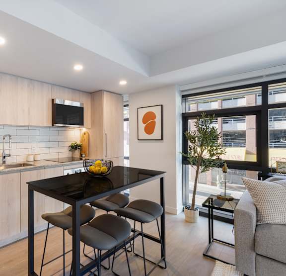 a kitchen with a marble counter top and a sink