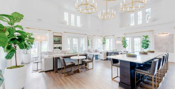 a dining room with white walls and a large table and chairs