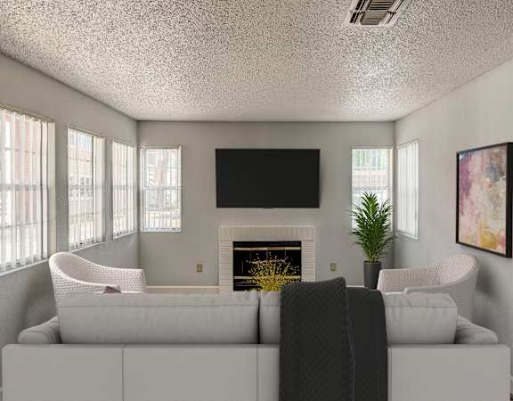 a living room with a white couch and a fireplace and a television