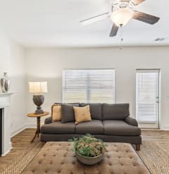 a living room with a couch and a fireplace