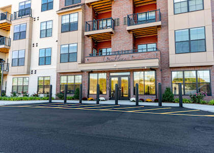 A large building with a balcony and a sign that says "Crestview".