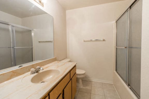 Bathroom with shower doors and large vanity at Fox Hill Glens