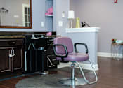 Thumbnail 3 of 5 - a purple chair in a room with a desk and a piano