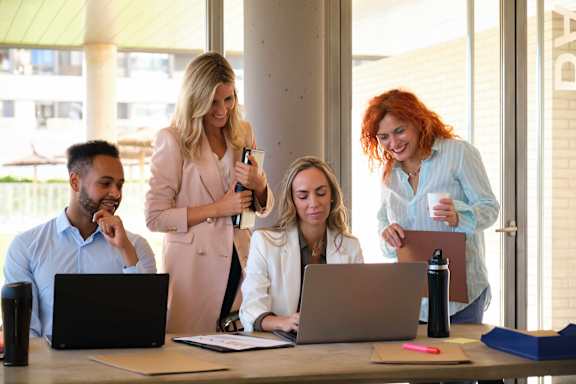 people working on computers in an office