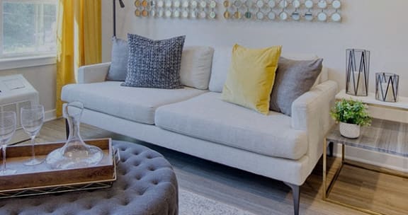 a living room with a couch and a coffee table at The Enclave, Jersey City, New Jersey