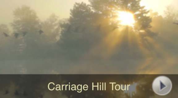 A sunrise scene with the text "Carriage Hill Tour" on a video player.