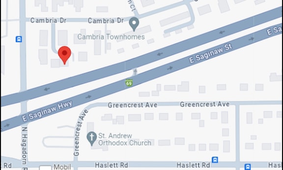 a screenshot of a map of a street with a red point at the intersection of