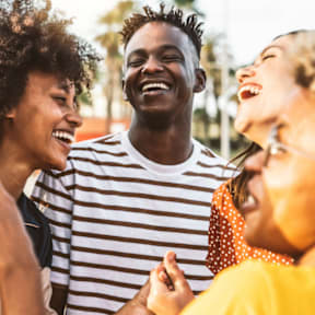 Group of People Laughing Together Outdoors