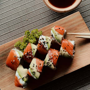Close Up View of Sushi on Wood Cutting Board
