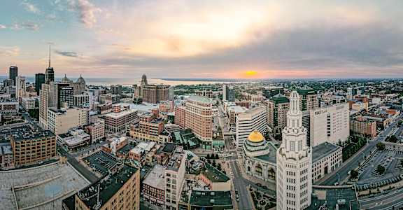an aerial view of the city at sunset at The Knights @ 506 Delaware Apartments, Buffalo, New York 14202