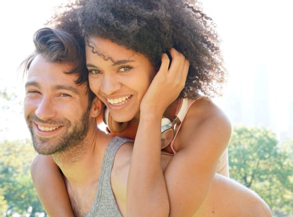 a man and a woman smiling and hugging each other at Anchor 532 Luxury Apartments, California, 94590