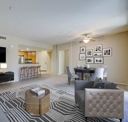 A living room with a grey couch, a coffee table, and a flat screen TV. at Sonoma at Porter Ranch, Porter Ranch, 91326