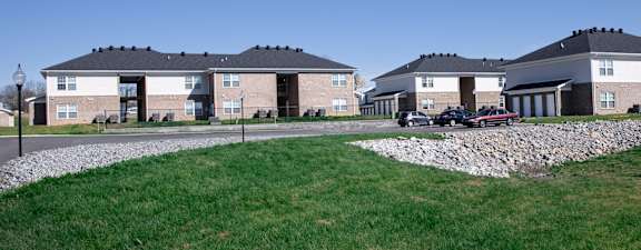 a group of houses on the side of a road