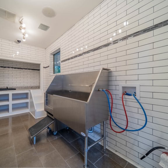 a bath room with a bath tub and a sink