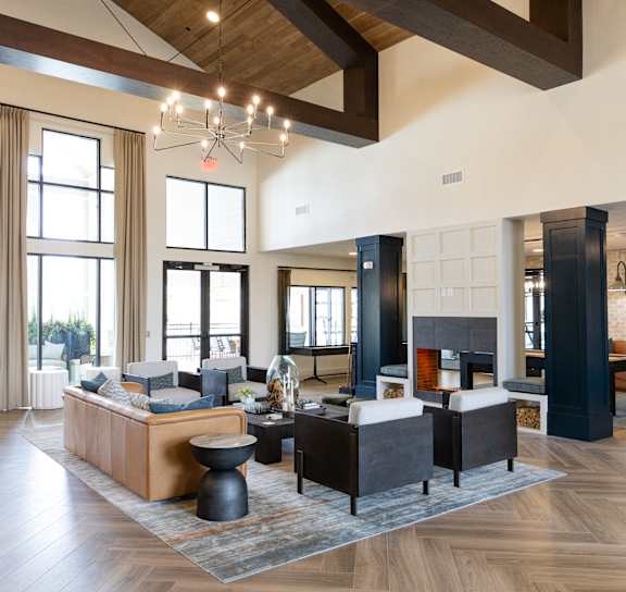 A large room with a wooden ceiling and a chandelier hanging from it.
