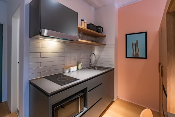 a small kitchen with a stove and a sink