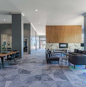 A modern living room with a dining table and a couch.