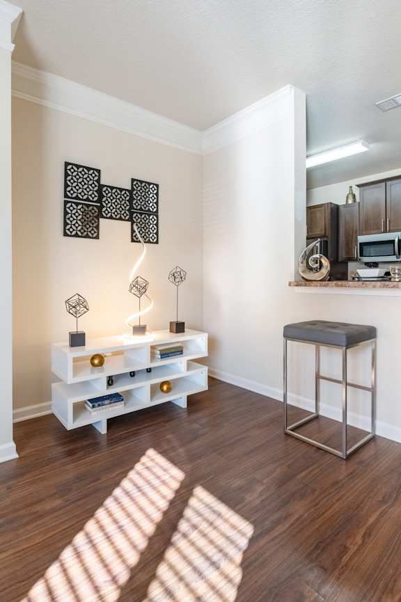 a dining room and kitchen with a table and chairs