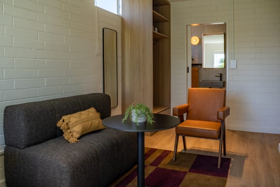 a living room with a couch and a table