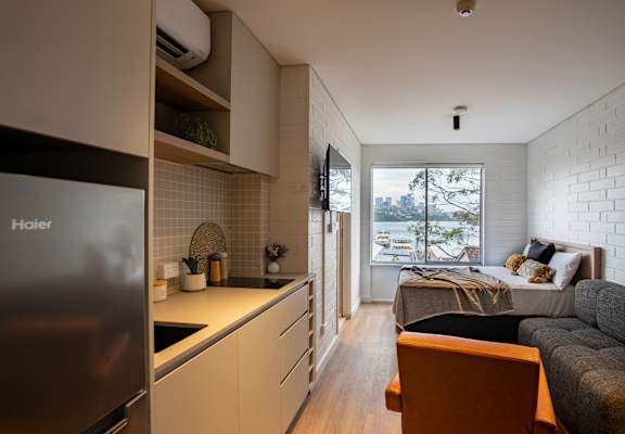 a kitchen and living room in a small apartment