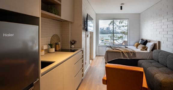 a kitchen and living room in a small apartment