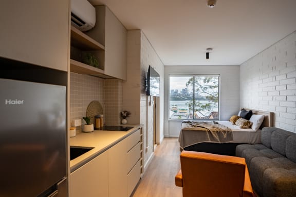 a kitchen and living room in a small apartment