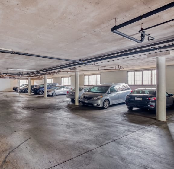 a parking garage with cars parked in it