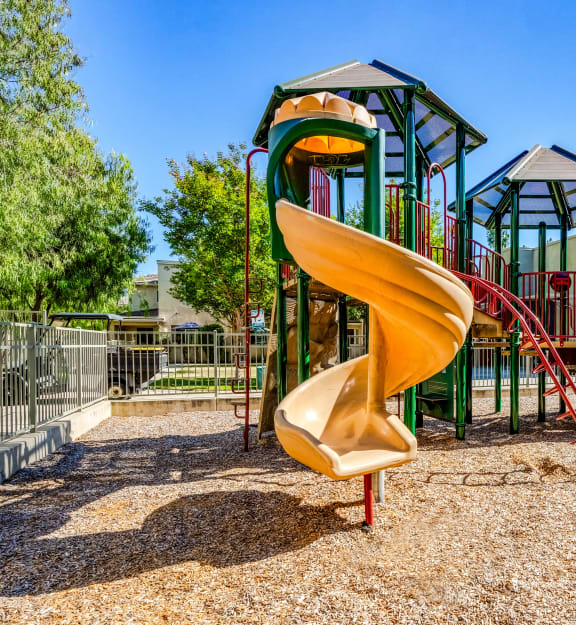 the playground at the preserve at polk apartments with a slide