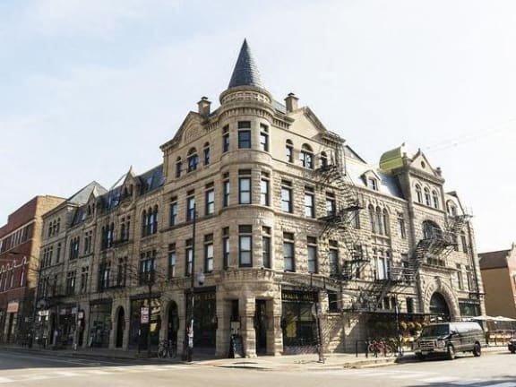 a large building on the corner of a street