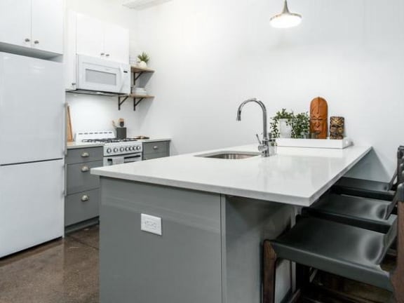 a kitchen with a sink and a counter top
