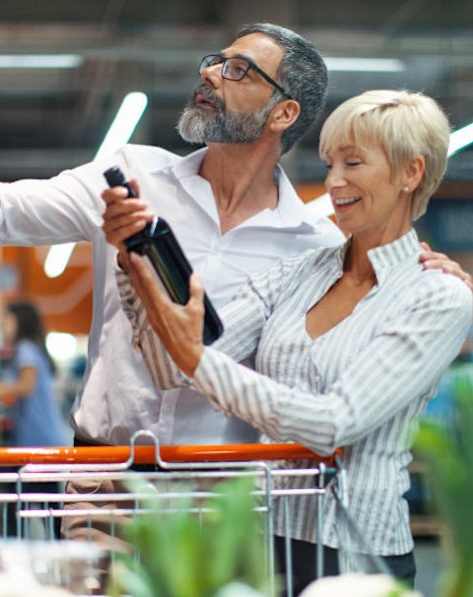 A man and a woman are shopping together in a store.