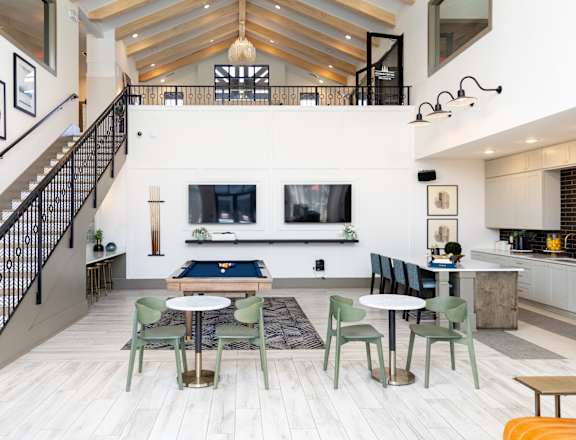 A modern open concept living space with a staircase.