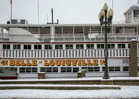 A large white building with the words "Belle Louisville" written on it.