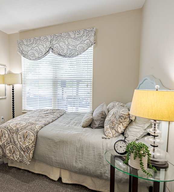 a bedroom with a large bed and a window at The Greyson, Ohio, 43026