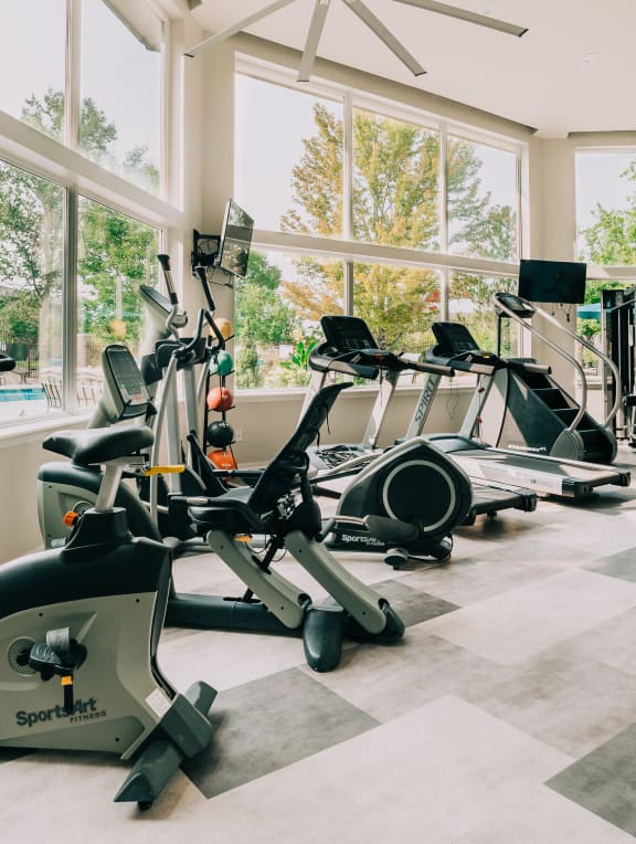 A gym with treadmills and exercise bikes. at Bridgwater, Greenwood Village, CO, 80111