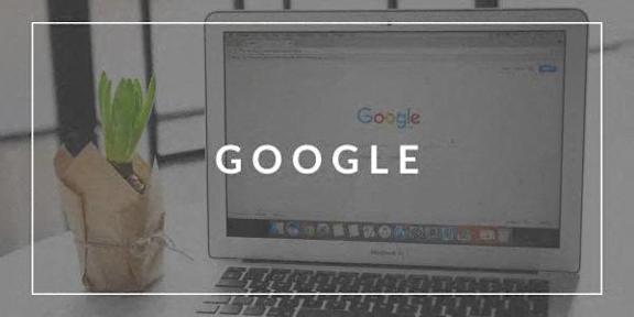 A laptop with the Google logo on the screen.