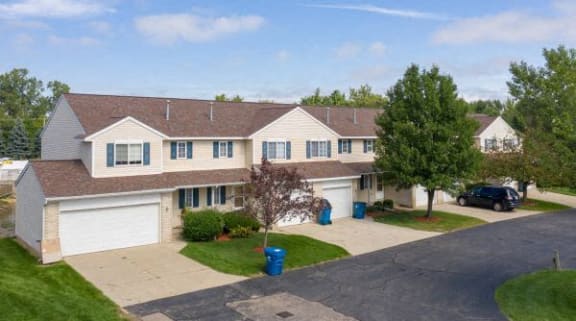 a house with a car parked in the driveway