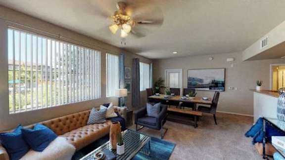 A dining room with a table set for four.