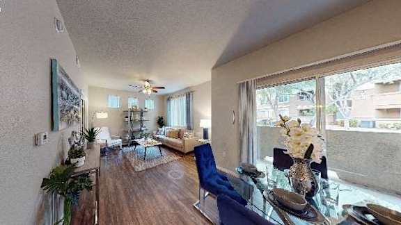A living room with a grey couch and a coffee table.