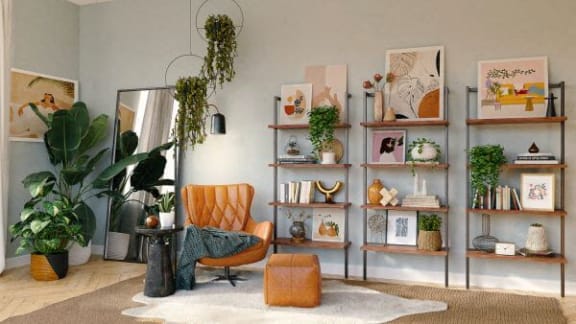 a living room with a chair and shelves with plants