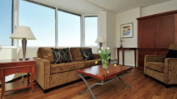 a living room and dining room with a couch and a table