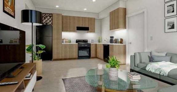 a living room with a glass table  and a kitchen