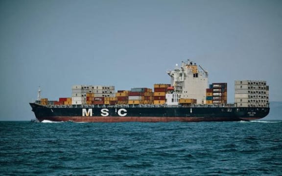 a large container ship in the middle of the water