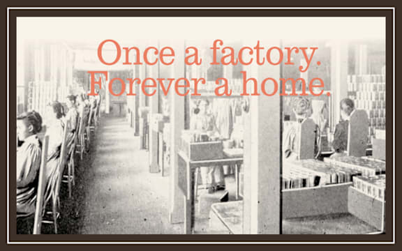 A black and white photo of a factory with the words "Once a factory. Forever a home." overlaid on it.
