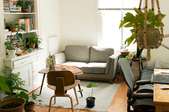 a living room filled with furniture and a large window