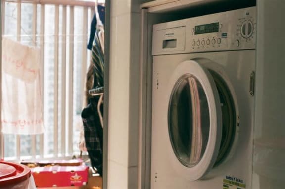 a washer and dryer in a kitchen next to a window