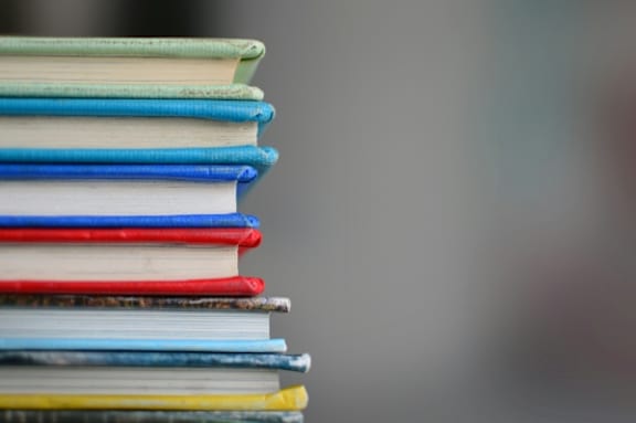 A stack of books with various colors.