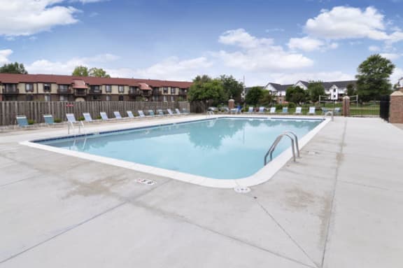Outdoor Pool with Lounge Chairs at West Wind Apartments in Fort Wayne, Indiana