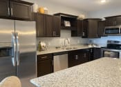Thumbnail 21 of 24 - kitchen with dark cabinets